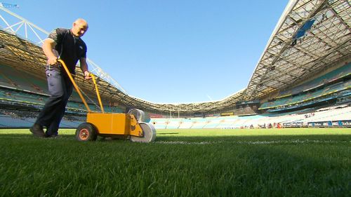 Preparing the field for the game. (9NEWS)
