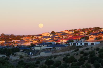 Full moon over an Australian city