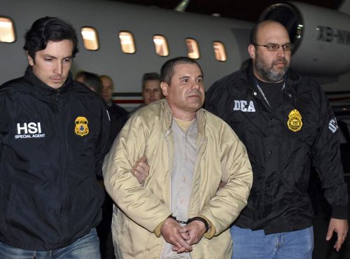 US authorities take Joaquin "El Chapo" Guzman into custody after his extradition from Mexico on January 19, 2017. 