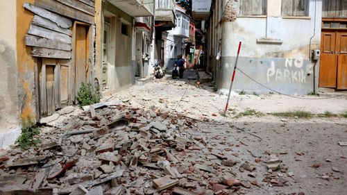 The debris of a damaged building after an earthquake in the village of Plomari on the northeastern Greek island of Lesbos. (AAP)