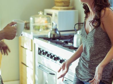 Couple arguing in a kitchen