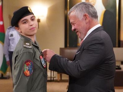 His Majesty King Abdullah II, Supreme Commander of the #Jordan Armed Forces, presents HRH Princess Salma bint Abdullah II with her wings after completing pilot training.