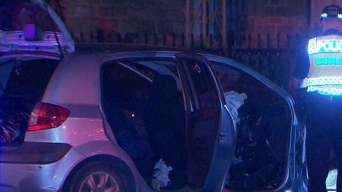 The car slammed into a power pole and brought down powerlines. (9NEWS)