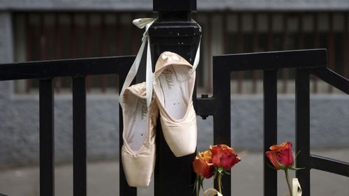 Ballet shoes are seen hanging on the fence of the Vladislav Ribnikar school in Belgrade, Serbia.
