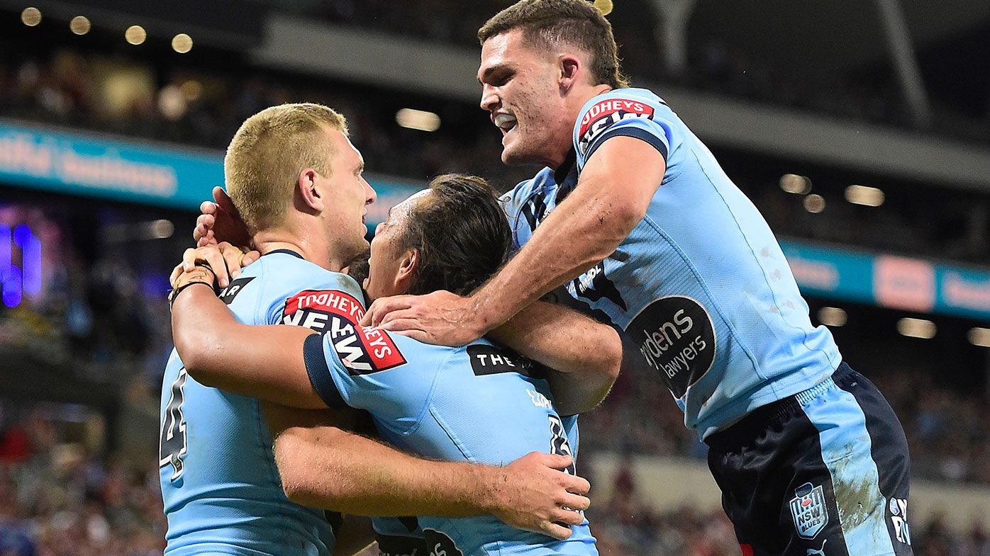 Tom Trbojevic of the Blues celebrates with team mates after scoring a try during game one of the 2021 State of Origin series between the New South Wales Blues and the Queensland Maroons at Queensland Country Bank Stadium on June 09, 2021 in Townsville, Australia. (Photo by Ian Hitchcock/Getty Images)