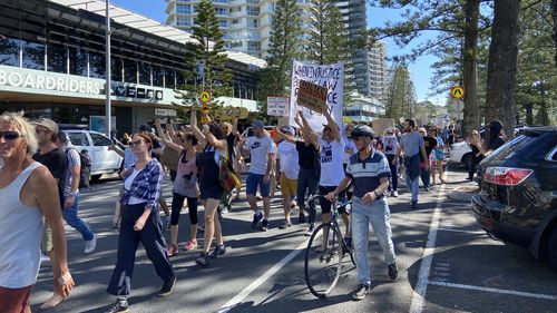 People gathered on Coolangatta Esplanade protesting an end to vaccinations and lockdown. 