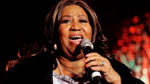 Aretha Franklin performs during the lighting ceremony of the Christmas tree outside the New York Stock Exchange in 2008.
