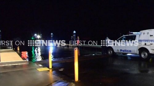 Police responded to reports a silver sedan had driven 15m into the water. (9NEWS)
