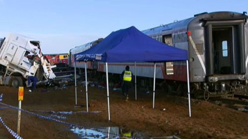 The operation to recover the train and damaged truck is expected to keep the line closed for four days. (9NEWS)