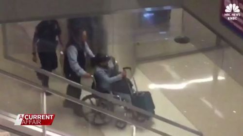 Marilou Danley is seen being wheeled through the airport at Los Angeles.