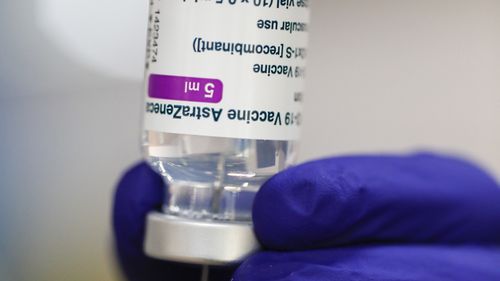 A medical worker prepares a syringe of the Astra Zeneca vaccine.