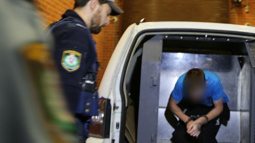 The man arrested in Lawson arrives at Katoomba Police Station. (NSW Police)