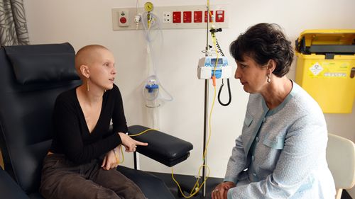 Cancer sufferer Matilda Kubany-Dean, 21, speaks to NSW Minister for Medical Research Pru Goward at Royal Prince Alfred Hospital in Sydney, December, 2016. Doctors are recruiting cancer patients in a world-first cannabis trial in NSW for the prevention of chemotherapy induced nausea and vomiting.