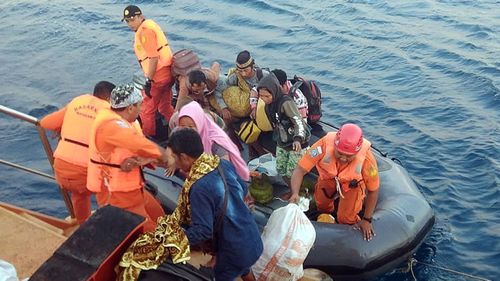 Indonesian Search and Rescue (Basarnas) evacuate residents from smaller islands after an earthquake struck in North Lombok