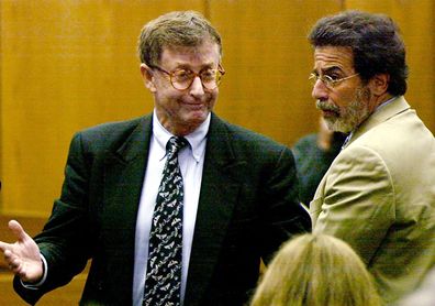 Michael Peterson, left, reacts after being found guilty of murdering his wife in October 2003. At right is his attorney David Rudolf. Novelist and onetime mayoral candidate Michael Peterson was found guilty of murdering his wife, whose body was found in a pool of blood at the bottom of a staircase in their home. His conviction was later overturned.