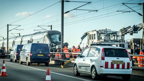 The company that maintains and controls rail network traffic, Banedanmark, said the train was heading towards the capital Copenhagen with 131 passengers when it hit what could have been a tarpaulin or something else from the freight train on the tracks.