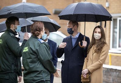 Britain's Prince William and Kate, Duchess of Cambridge talk with ambulance crew during a visit to Newham ambulance station, in East London, Thursday March 18, 2021.