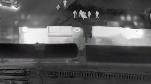 A police chase became a race against a speeding train after a suspect stole a patrol car in the USA.The chase in Atlanta quickly turned into a harrowing rescue all caught on camera.