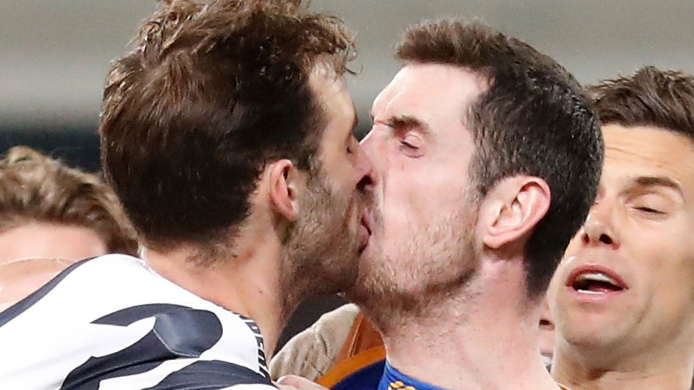 Giants' Jeremy Finlayson and Lions' Darcy Gardiner snapped in AFL finals 'kiss'