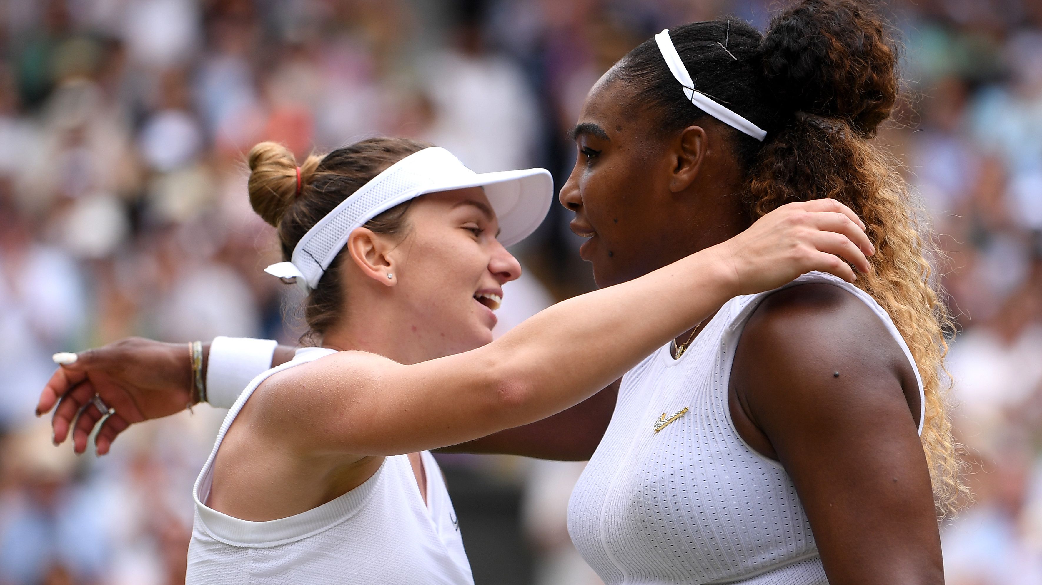 Simona Halep and Serena Williams embrace at the end of the 2019 Wimbledon final.