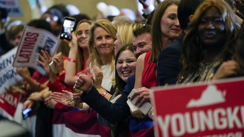 Supporters of Republican gubernatorial candidate Glenn Youngkin gather for an election night party. 