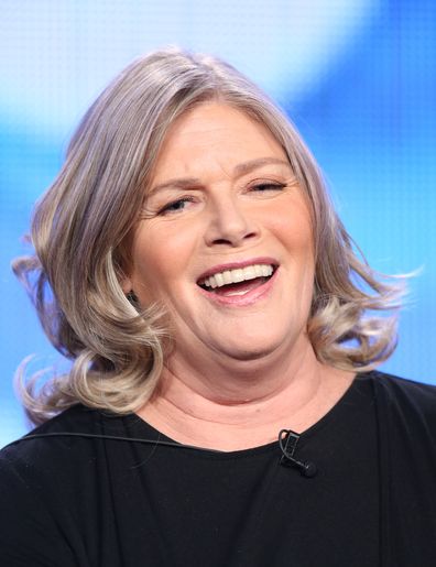 Kelly McGillis peaks onstage during the 'XXX' panel discussion at the ZZZZ  portion of the 2014  Winter Television Critics Association tour at the Langham Hotel on January 11, 2014 in Pasadena, California.