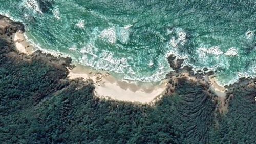 Paramedics had to be winched to the remote beach after the man was pulled from the surf unconscious. 