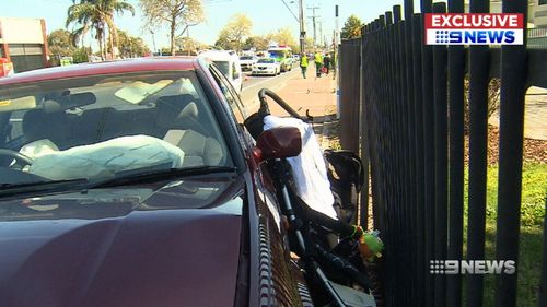 The father was able to lift his daughters up out of the way of the vehicle and to safety before it pinned him and the pram to a fence.