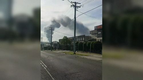 The fire created thick plumes of smoke over the suburb.