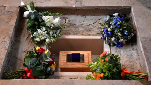 A memorial stone above his ashes is inscribed with his most famous black hole equation. Picture: Getty