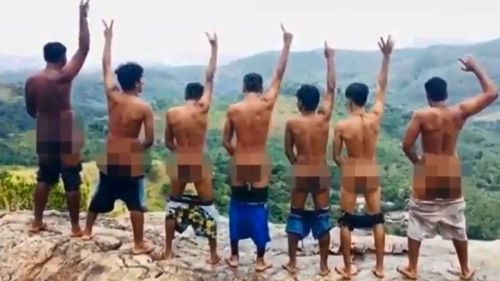 This photo from Sri Lankan police shows a group of men with bare bums on Pidurangala Rock. Three were later arrested by police.