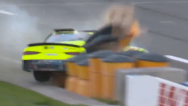 Brandon Jones collides with the sand barrels positioned at the beginning of pit road.