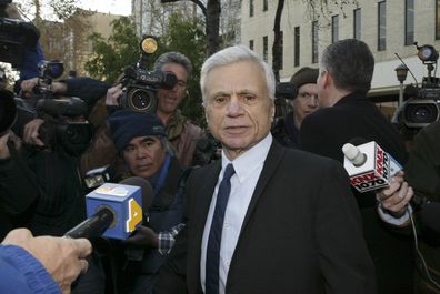 Actor Robert Blake speaks to reporters outside the courthouse as he arrives for a pre-trial hearing in Van Nuys, Calif. December 6, 2004.