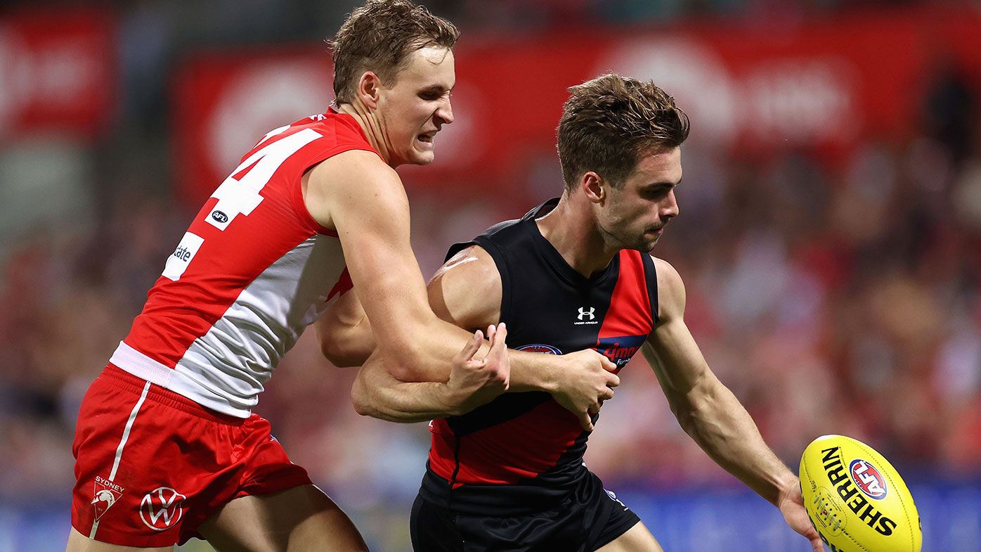 Will Snelling of the Bombers is tackled by Jordan Dawson of the Swans during the round four AFL match between the Sydney Swans and the Essendon Bombers at Sydney Cricket Ground on April 08, 2021 