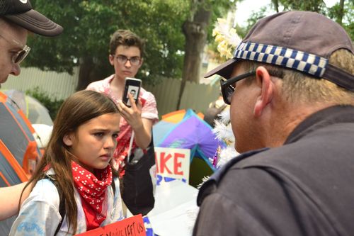 Issy had tears in her eyes as the officer issued her and her father a move along direction.