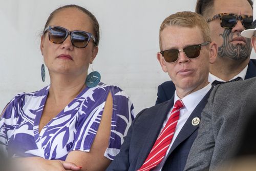 New Zealand's incoming Prime Minister Chris Hipkins, right, and Carmel Sepuloni listen during speeches in Ratana, New Zealand, Tuesday, Jan. 24, 2023. 