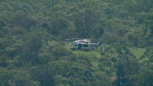 The CareFlight helicopter has landed in Engadine after reports of a child being struck by a car. (9NEWS Choppercam)