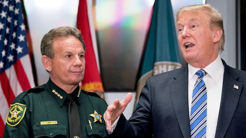 President Donald Trump, accompanied by Broward County Sheriff Scott Israel, left, speaks to law enforcement officers in Florida after the shooting. (AP).