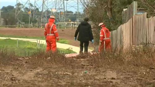 Police are investigating whether a reserve which backs onto the home was used as an escape route. (9NEWS)