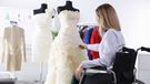 Bride, who is a wheelchair user, looking at wedding dress