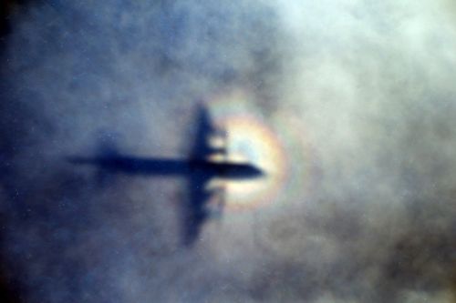 The shadow of a Royal New Zealand Air Force P3 Orion is seen on low level cloud while the aircraft searches for missing Malaysia Airlines Flight MH370. Picture: AP