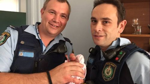 Sydney police officers rescue tiny joey after mother kangaroo dies in car crash