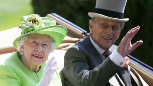 Queen Elizabeth II and her husband Prince Philip, Duke of Edinburgh travel by horse-drawn carriage as they arrive on day one of the Royal Ascot horse racing meet last year. 