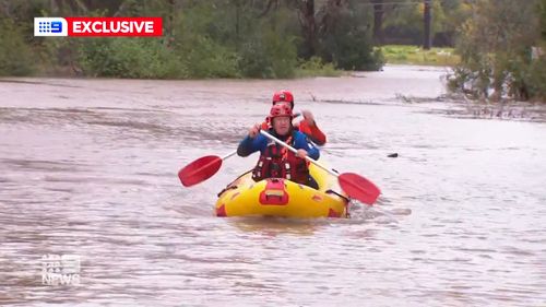The SES uses kayaks to rescue people in Sydney.