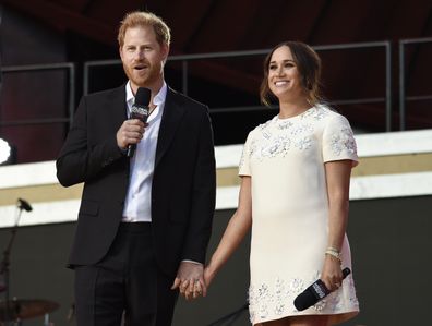 Prince Harry, the Duke of Sussex, left, and Meghan, the Duchess of Sussex speak at Global Citizen Live in Central Park on Saturday, Sept. 25, 2021, in New York. (Photo by Evan Agostini/Invision/AP)