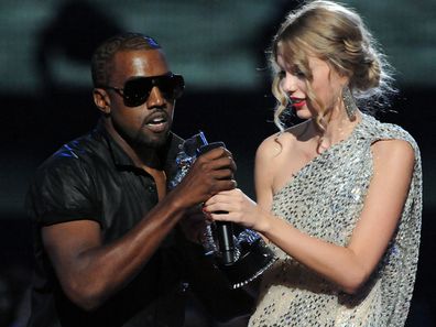 Kanye West jumps onstage as Taylor Swift accepts her award for the "Best Female Video" award during the 2009 MTV Video Music Awards at Radio City Music Hall on September 13, 2009 in New York City. 