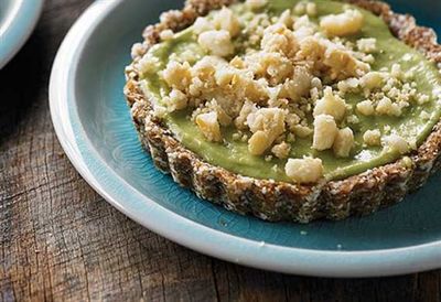 Coconut and lime tartlets topped with macadamia nuts