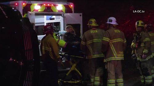 Actor Will Ferrell loaded into an ambulance after a shocking crash in California. (ABC US)