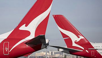 Qantas jet tails at Sydney Airport (Getty)