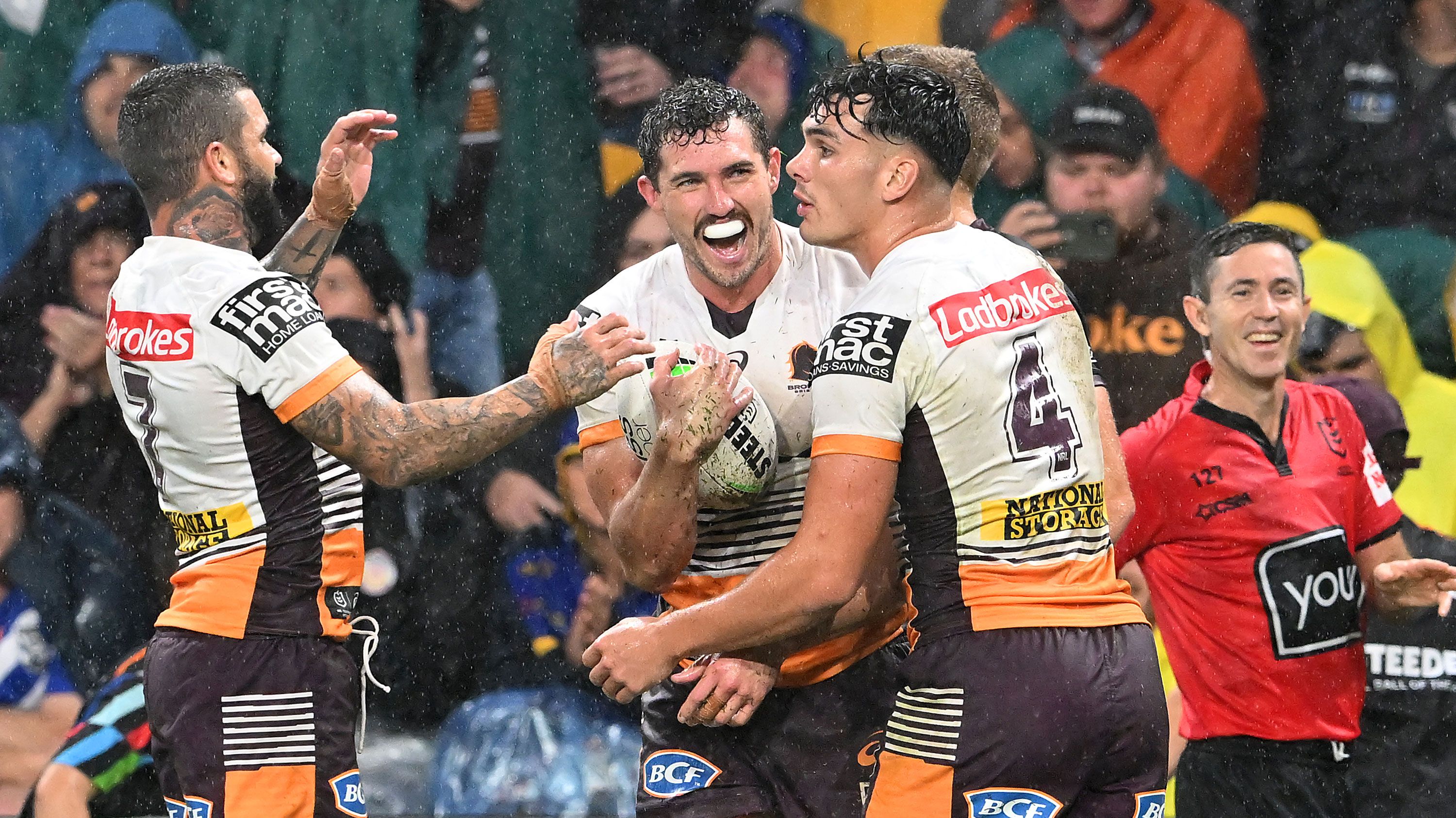 The Broncos celebrate a Corey Oates try against Manly in Magic Round.